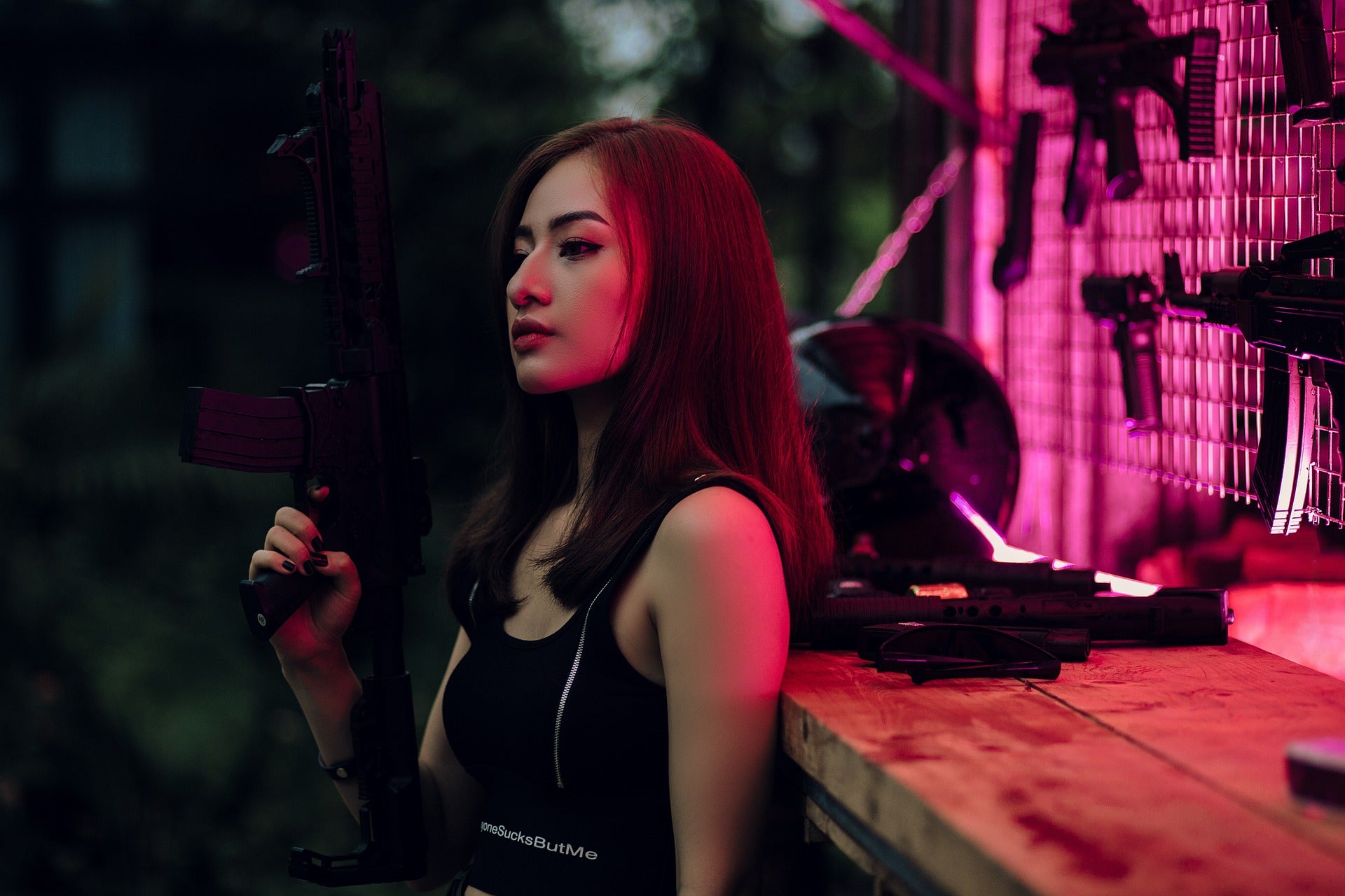 A woman holding a Nerf Auto Gun